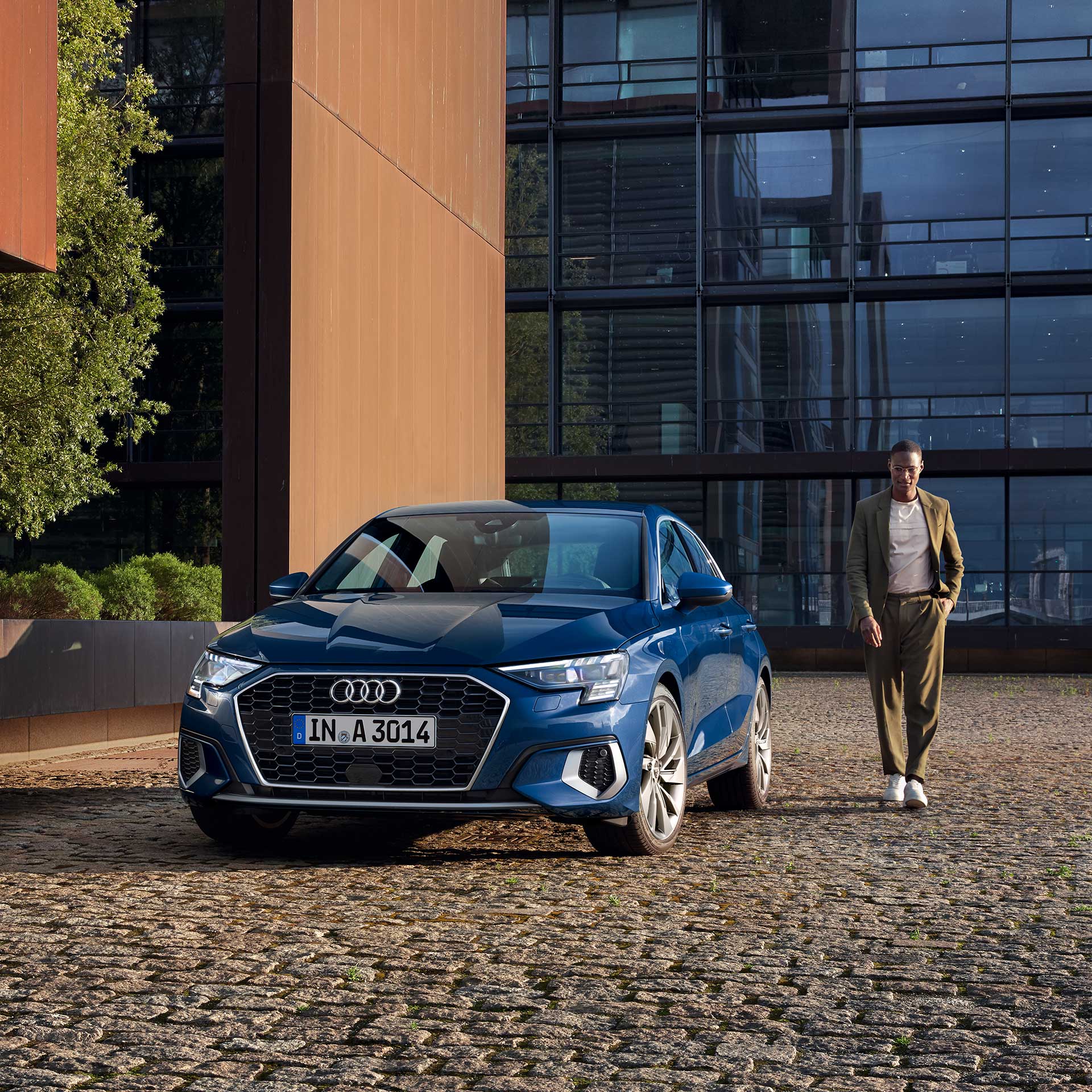 Audi A3 Sportback front view with model on the side